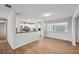 Spacious living room with wood-look floors and kitchen access at 8109 San Jacinto Ave, North Port, FL 34287