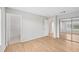 Bedroom with wood-look floors and access to a private bathroom at 8109 San Jacinto Ave, North Port, FL 34287