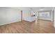 Bright living room featuring wood-look flooring and neutral walls at 8109 San Jacinto Ave, North Port, FL 34287