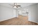 Open living area with wood-look floors and views to the kitchen at 8109 San Jacinto Ave, North Port, FL 34287