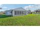 Single story house with sunroom and attached garage, spacious lawn at 8109 San Jacinto Ave, North Port, FL 34287