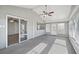Bright sunroom with sliding glass doors and a ceiling fan at 8109 San Jacinto Ave, North Port, FL 34287