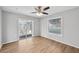 Bright bedroom with wood-look floors and sliding glass door to patio at 8109 San Jacinto Ave, North Port, FL 34287
