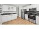 Updated kitchen with stainless steel appliances and white cabinets at 8109 San Jacinto Ave, North Port, FL 34287