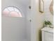 Modern tiled shower featuring a half-moon privacy window and gold hardware at 956 Harbor Town Dr, Venice, FL 34292