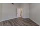 An inviting bedroom space with modern flooring, neutral paint, and an ensuite bathroom doorway, ready for personalization at 956 Harbor Town Dr, Venice, FL 34292