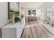 Elegant living and dining area with wood floors, featuring contemporary decor at 956 Harbor Town Dr, Venice, FL 34292