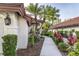 Lush tropical landscaping lining the walkway to the entrance at 956 Harbor Town Dr, Venice, FL 34292
