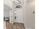 Welcoming foyer with natural lighting and a stylish front door, offering a warm and inviting entrance at 956 Harbor Town Dr, Venice, FL 34292