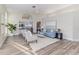 Bright open-concept living room featuring vaulted ceilings, and views of the dining room and kitchen at 956 Harbor Town Dr, Venice, FL 34292