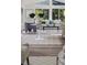 Open-concept living area with ample natural light, stylish furniture, and modern flooring at 956 Harbor Town Dr, Venice, FL 34292