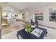 Open floor plan featuring living room with vaulted ceiling, wood floors and lots of natural light at 956 Harbor Town Dr, Venice, FL 34292
