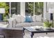 Comfortable living room featuring a plush sofa, stylish pillows, and a decorative coffee table at 956 Harbor Town Dr, Venice, FL 34292