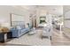 Bright living room with wood floors, high ceilings, and modern furnishings at 956 Harbor Town Dr, Venice, FL 34292