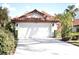 House exterior with double garage and landscaping at 956 Harbor Town Dr, Venice, FL 34292