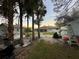 View of the home's backyard, sheds and landscaping at 20246 Hamilton Ave, Port Charlotte, FL 33952