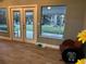 French doors open to a backyard patio and view at 20246 Hamilton Ave, Port Charlotte, FL 33952