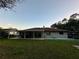 House exterior showcasing a large backyard at 20246 Hamilton Ave, Port Charlotte, FL 33952