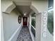 Elegant entryway with arched hallway and tile flooring at 20246 Hamilton Ave, Port Charlotte, FL 33952
