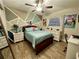 Well-lit bedroom with a unique geometric wall design and a desk area at 20246 Hamilton Ave, Port Charlotte, FL 33952