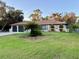 Single-story home with a two-car garage and manicured lawn at 20246 Hamilton Ave, Port Charlotte, FL 33952