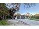 Single-story home with a two-car garage and spacious driveway at 20246 Hamilton Ave, Port Charlotte, FL 33952