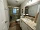 Clean bathroom with a shower/tub combo and updated vanity at 20246 Hamilton Ave, Port Charlotte, FL 33952