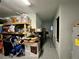 Large garage with ample storage shelving and space for multiple vehicles at 20246 Hamilton Ave, Port Charlotte, FL 33952