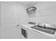 Laundry room with washer, dryer, and shelving at 14624 Sycamore Ct # 2512, Punta Gorda, FL 33955