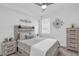 Guest bedroom with a queen-size bed and neutral decor at 14624 Sycamore Ct # 2512, Punta Gorda, FL 33955