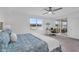 Main bedroom with private balcony access and a workspace at 14624 Sycamore Ct # 2512, Punta Gorda, FL 33955