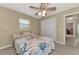 Bedroom with ceiling fan, window, and a built-in desk area at 2291 Meetze St, Port Charlotte, FL 33953