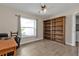 Bright home office featuring built-in shelving and plenty of natural light at 2105 Holland St, North Port, FL 34288