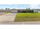 Single Gathering home with attached garage and landscaping at 543 Lincoln Nw Ave, Port Charlotte, FL 33952
