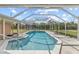 Inviting screened pool with a spacious, sun-drenched deck at 543 Lincoln Nw Ave, Port Charlotte, FL 33952