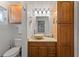 Bathroom with wood cabinets, vessel sink, and shower at 543 Lincoln Nw Ave, Port Charlotte, FL 33952