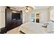 Bedroom with pool view, large built-in entertainment center and comfortable bed at 543 Lincoln Nw Ave, Port Charlotte, FL 33952