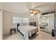 Bright bedroom with a queen-size bed and mirrored closet at 543 Lincoln Nw Ave, Port Charlotte, FL 33952
