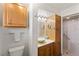 Clean bathroom with wood cabinets, vessel sink, and walk-in shower at 543 Lincoln Nw Ave, Port Charlotte, FL 33952