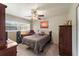 Bedroom with double bed, dresser, and ceiling fan at 543 Lincoln Nw Ave, Port Charlotte, FL 33952