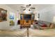 Comfortable living room with leather sofas and large TV at 543 Lincoln Nw Ave, Port Charlotte, FL 33952