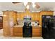 Modern kitchen with stainless steel appliances and wood cabinets at 543 Lincoln Nw Ave, Port Charlotte, FL 33952