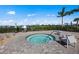 Relaxing hot tub with surrounding patio furniture at 25072 Purple Emperor Way, Punta Gorda, FL 33955