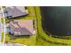 Aerial view of a home next to a lake in Brightmore at 11247 Boundless Ter, Venice, FL 34293