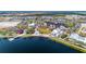 Aerial view of a vibrant town center with lakefront access and shops at 11247 Boundless Ter, Venice, FL 34293