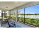 Relaxing screened patio overlooking a lake, perfect for outdoor dining at 14625 Sycamore Ct # 2411, Punta Gorda, FL 33955