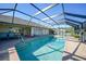 Inviting screened pool with ample deck space for lounging at 18404 Lake Worth Blvd, Port Charlotte, FL 33948