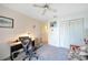 Home office featuring a desk, comfortable chair, and ample closet space at 18404 Lake Worth Blvd, Port Charlotte, FL 33948