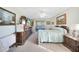Spacious bedroom with a queen-size bed and wood furniture at 18404 Lake Worth Blvd, Port Charlotte, FL 33948