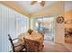 Bright dining area with table and chairs, overlooking the patio at 18404 Lake Worth Blvd, Port Charlotte, FL 33948